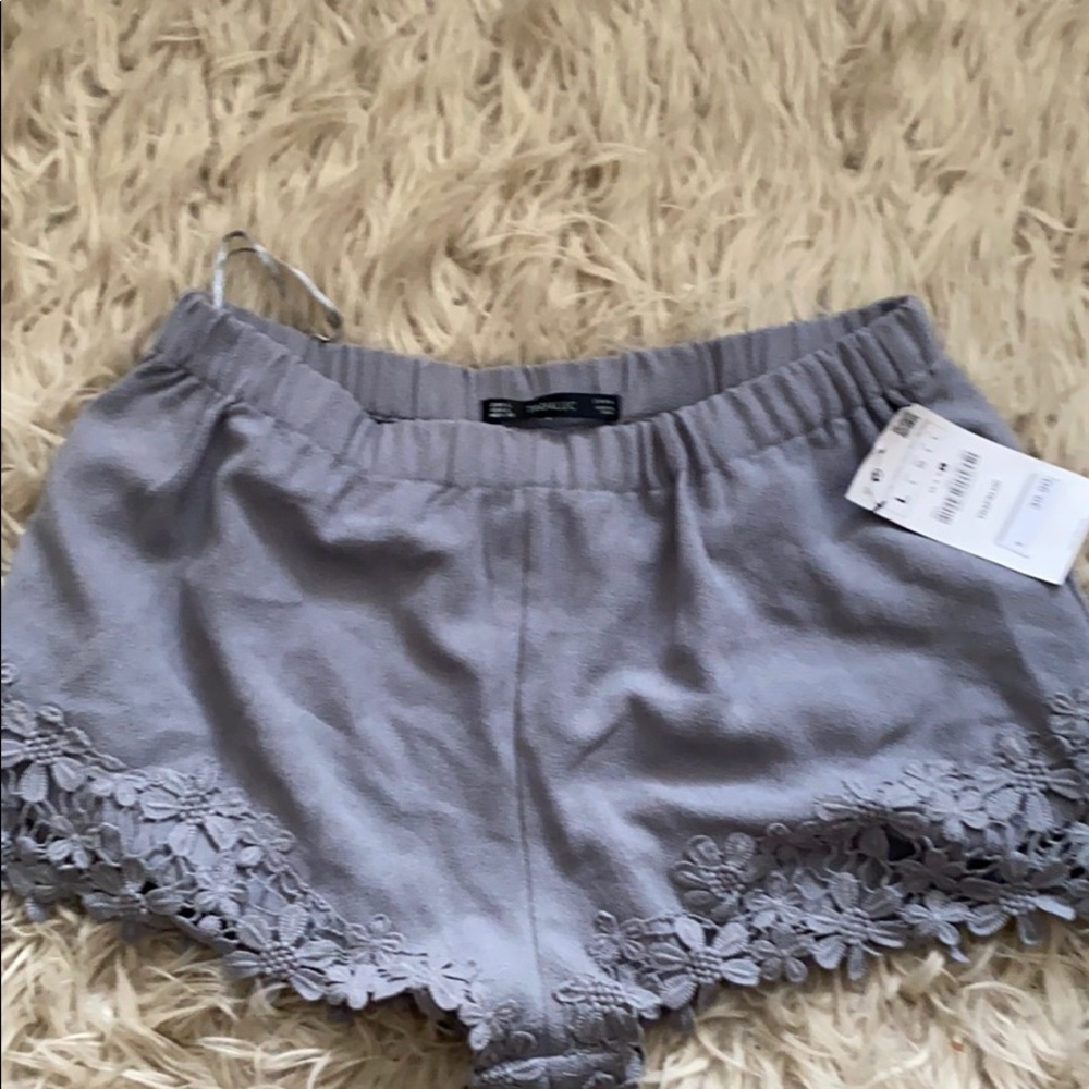Gray Zara shorts with floral detail
